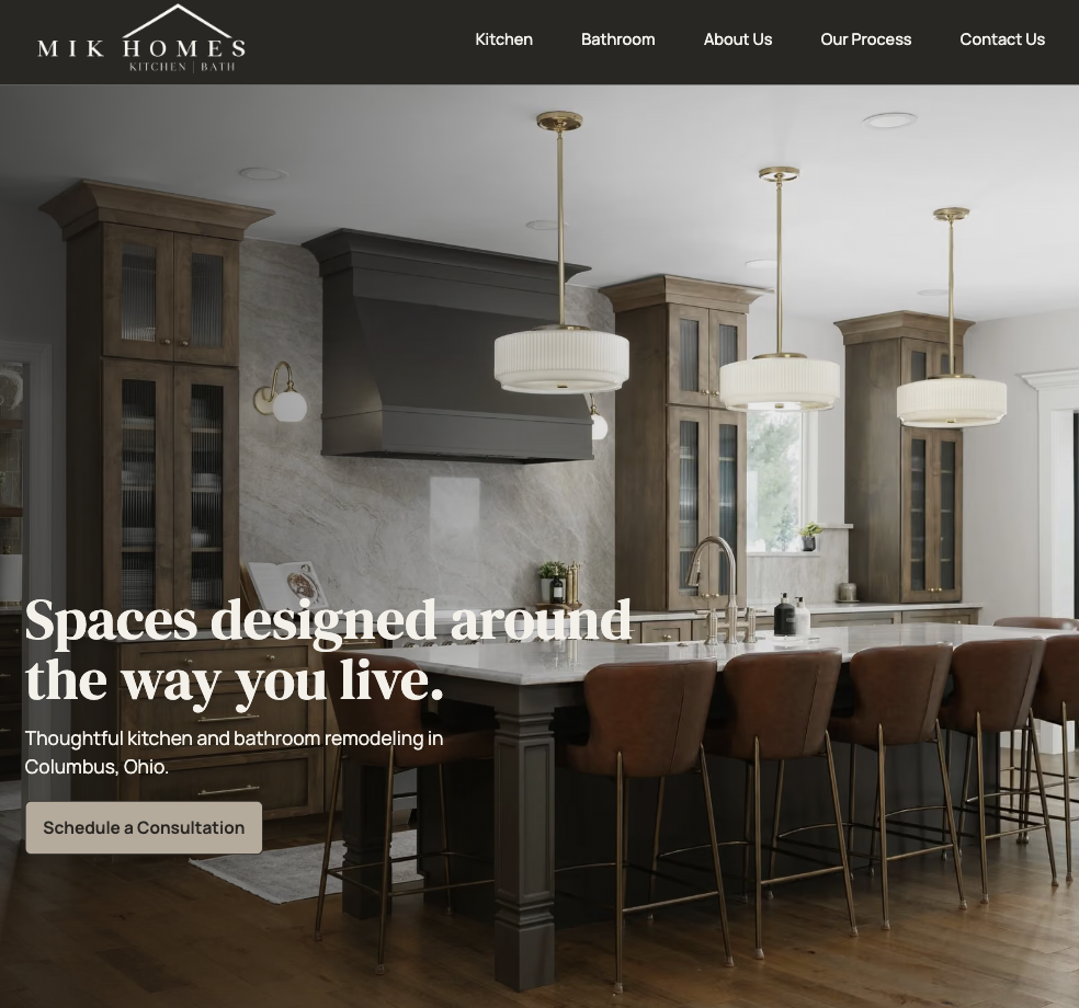High-fidelity MIK Homes homepage hero showing the restrained visual direction and project photography
